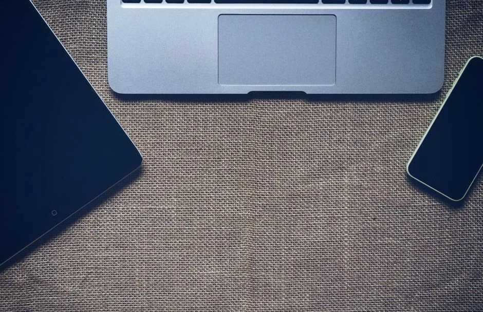 Close-up of a laptop showing the Pexels login interface with a blurred background, creating a moody tech scene.